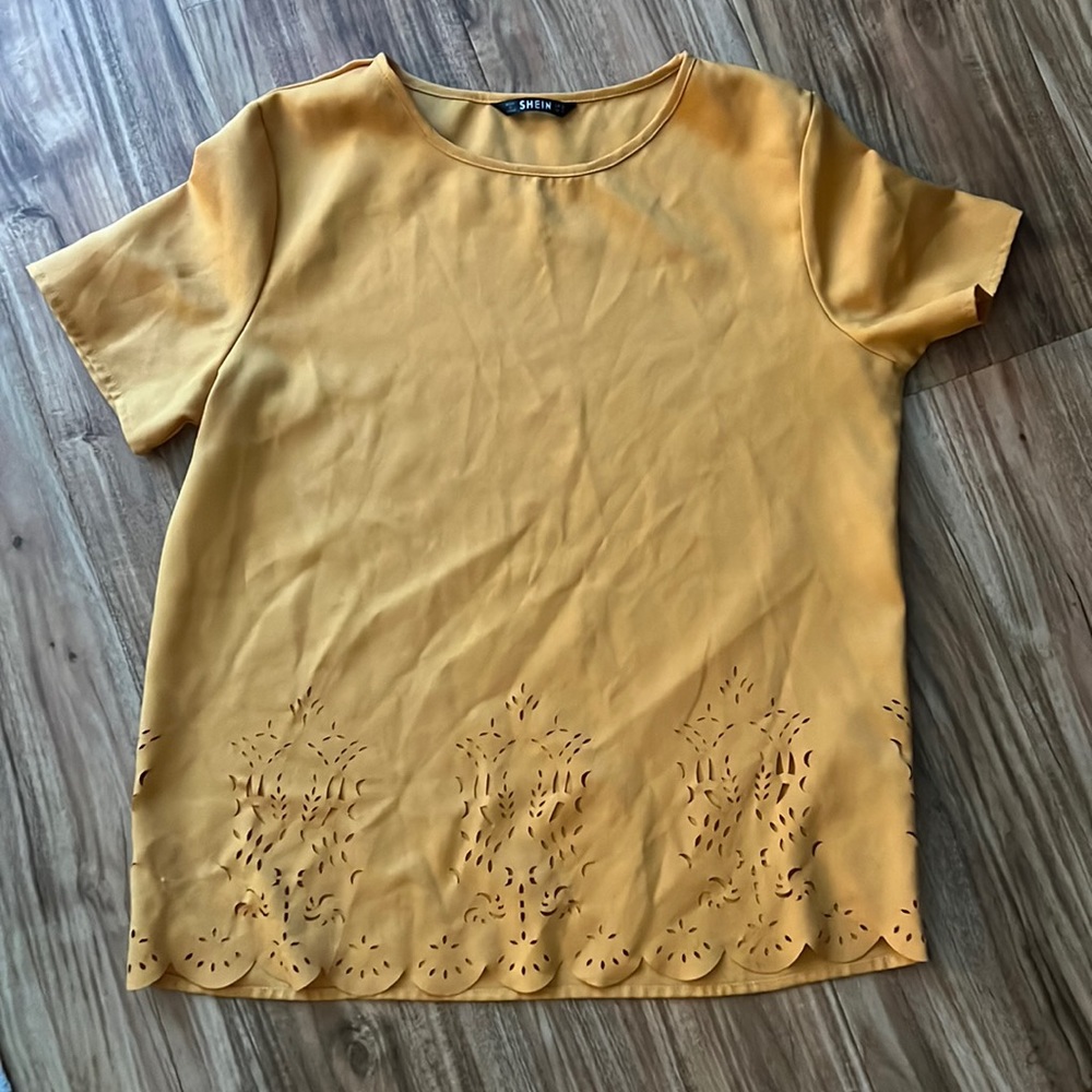 Mustard color shirt with cutout design